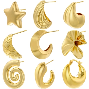 Nine pairs of vintage gold geometric earrings including star and spiral designs on white
