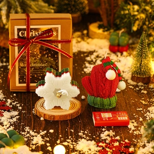 Christmas scented candle gift set with snowflake and red glove shapes in festive packaging