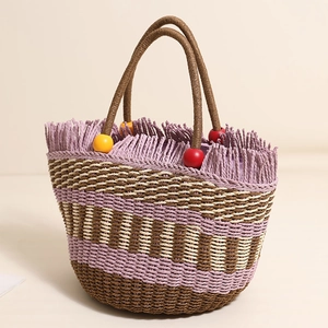 Straw tote bag with colorful wooden beads and purple tassels for beach vacation