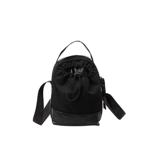 Minimalist black drawstring bucket bag with durable nylon and adjustable shoulder strap