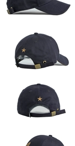 Detail of navy cotton baseball cap with golden star embroidery and vintage metal buckle