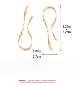 Detailed view of large gold-tone liquid-style irregular teardrop earrings with dimensions
