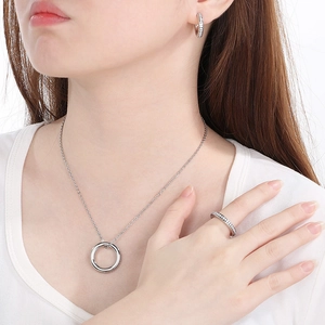 Chic silver C-shape jewelry set with sparkling rhinestones worn by a model