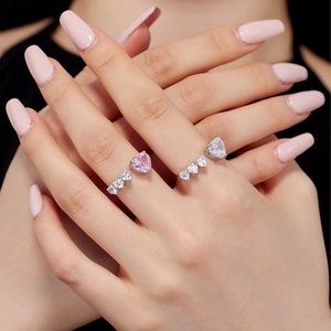 S925 sterling silver open rings with pink and clear heart zircon stones on a model hand