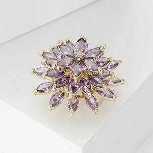 Elegant gold flower ring featuring tiered purple marquise crystals and a center gem
