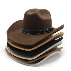Stacked collection of vintage western fedora hats with leather bands in multiple colors