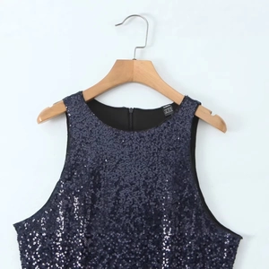 Navy blue sleeveless dress with sparkling sequins and hidden zipper on plain background