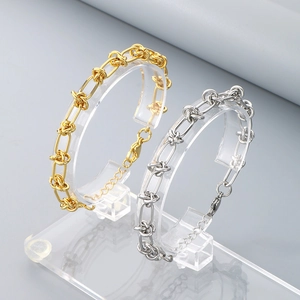 Bracelet à maillons noués chic en acier titane doré et argenté avec fermoir mousqueton