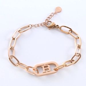 Minimalist rose gold stainless steel chain bracelet featuring an oval letter B charm
