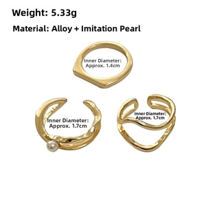 Detail showing set of 3 gold geometric rings with 5.33g weight and alloy material