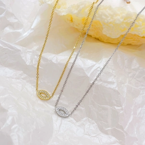 Fashionable evil eye necklaces in gold and silver with sparkling oval crystal pendants