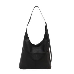 Minimalist black Hobo shoulder bag with front pocket and adjustable strap on white background