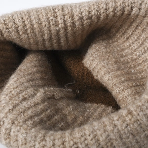 Winter wool knitted beanie for women featuring thick ribbed texture and khaki warm lining