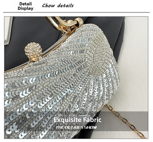 Detail of silver sequin evening bag featuring beadwork and rhinestone sphere clasp