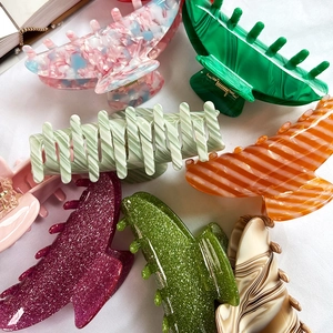 Set of large French acetate claw clips in marble, striped, and glitter patterns