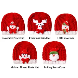 Detail showing five red Christmas knitted baby hats with snowman and reindeer patterns