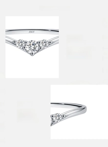 Macro shot of V-shaped S925 silver ring with D color VVS1 moissanite diamond detail
