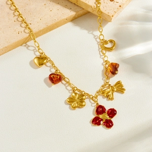 Collier en acier inoxydable doré avec pendentifs fleurs, cœurs et nœud chic