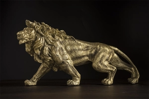 Detailed view of golden lion sculpture with intricate muscle lines and metallic texture