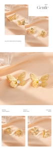 Macro view of gold hollow butterfly and flower stud earrings with sparkling zircons