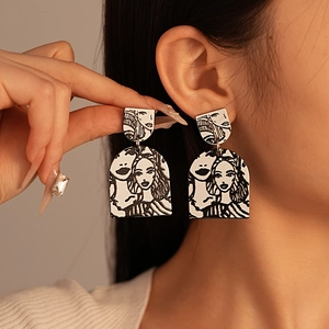 Artistic acrylic earrings with black and white abstract woman portrait illustrations