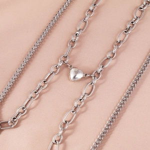 Double-layer stainless steel heart magnet bracelet with polished silver finish on silk