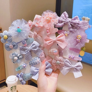 Set of colorful fabric hair bows and clips for girls with lace and flower details