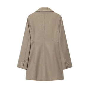 Detail of oatmeal wool blend coat back showing professional tailoring and cuff gold buttons