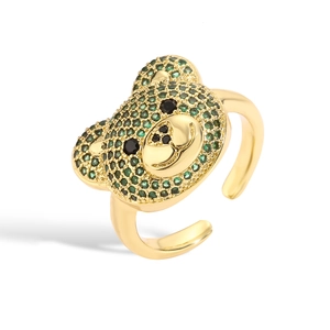 Adjustable gold bear ring featuring green micro-pave crystals and a cute bow design