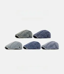 Detail showing five vintage washed denim flat caps with adjustable metal buckles