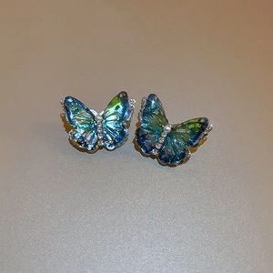 Elegant butterfly stud earrings with blue gradient acrylic wings and pearl accents