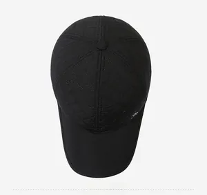 Top view of black quilted winter baseball cap with earmuffs and metallic kangaroo logo