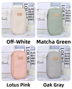 Quilted pouch with leather tag in four colors including beige, green, pink and grey