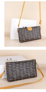 Detail of a brown small square bag with all-over logo print and golden hardware