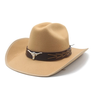 Detail of khaki felt cowboy hat featuring leather band and silver bull head ornament