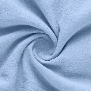 Close-up of light blue linen fabric texture showing breathable woven material detail