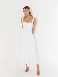 Detail of white sleeveless midi dress with square neck and elegant pleated skirt