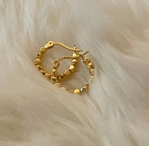 Macro view of S925 hallmark on gold plated irregular geometric sterling silver earrings
