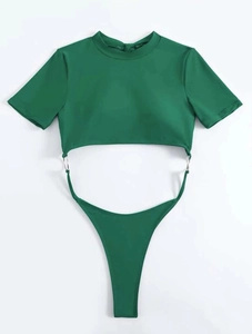 Detail of dark green bikini with silver rings and high-neck short sleeve crop top