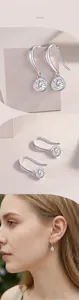 Detail van de S925 zilveren druppeloorbellen met ronde moissaniet edelstenen
