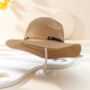 Straw jazz hat with black leather strap and gold chain detail in natural wood color