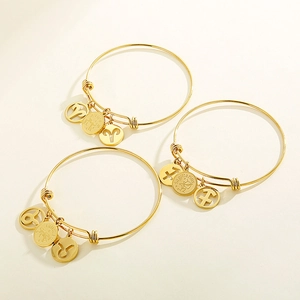 Minimalist gold-plated stainless steel zodiac charm bangles with constellation pendants