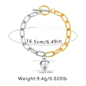 Two-tone mixed metal bracelet with heart pendant showing size 16.5cm and 9.4g weight
