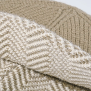 Thick khaki and beige winter knit bucket hat featuring classic herringbone texture