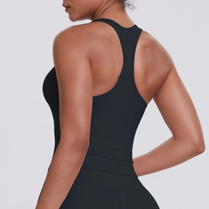Close-up of black racerback sports tank top with high-elasticity matte fabric on model