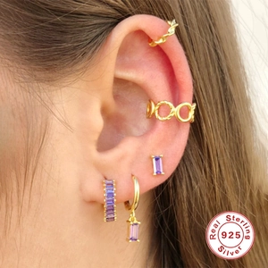 Elegant 925 sterling silver gold-plated studs with purple rectangular cut crystals
