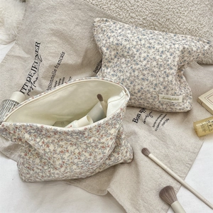 Macro detail of large capacity floral corduroy makeup bags for cosmetic storage