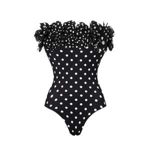 Chic black polka dot one-piece swimsuit featuring 3D floral petals on a strapless neckline