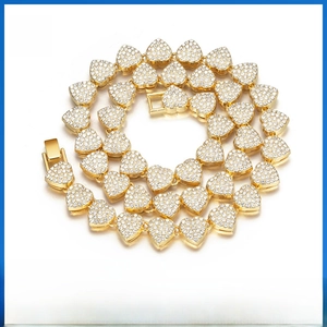 Close-up of gold-plated heart link chain with micro-pave crystals and secure clasp