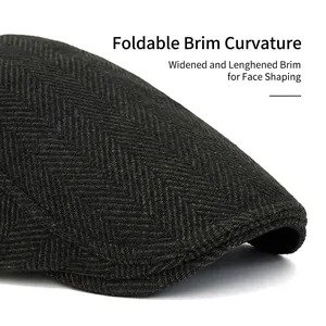Men's herringbone tweed newsboy cap in dark grey wool blend with foldable brim feature